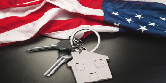 Keys to a home and american flag