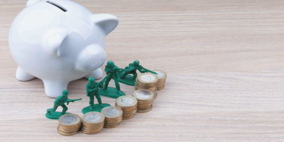 Toy soliders protecting a piggy bank